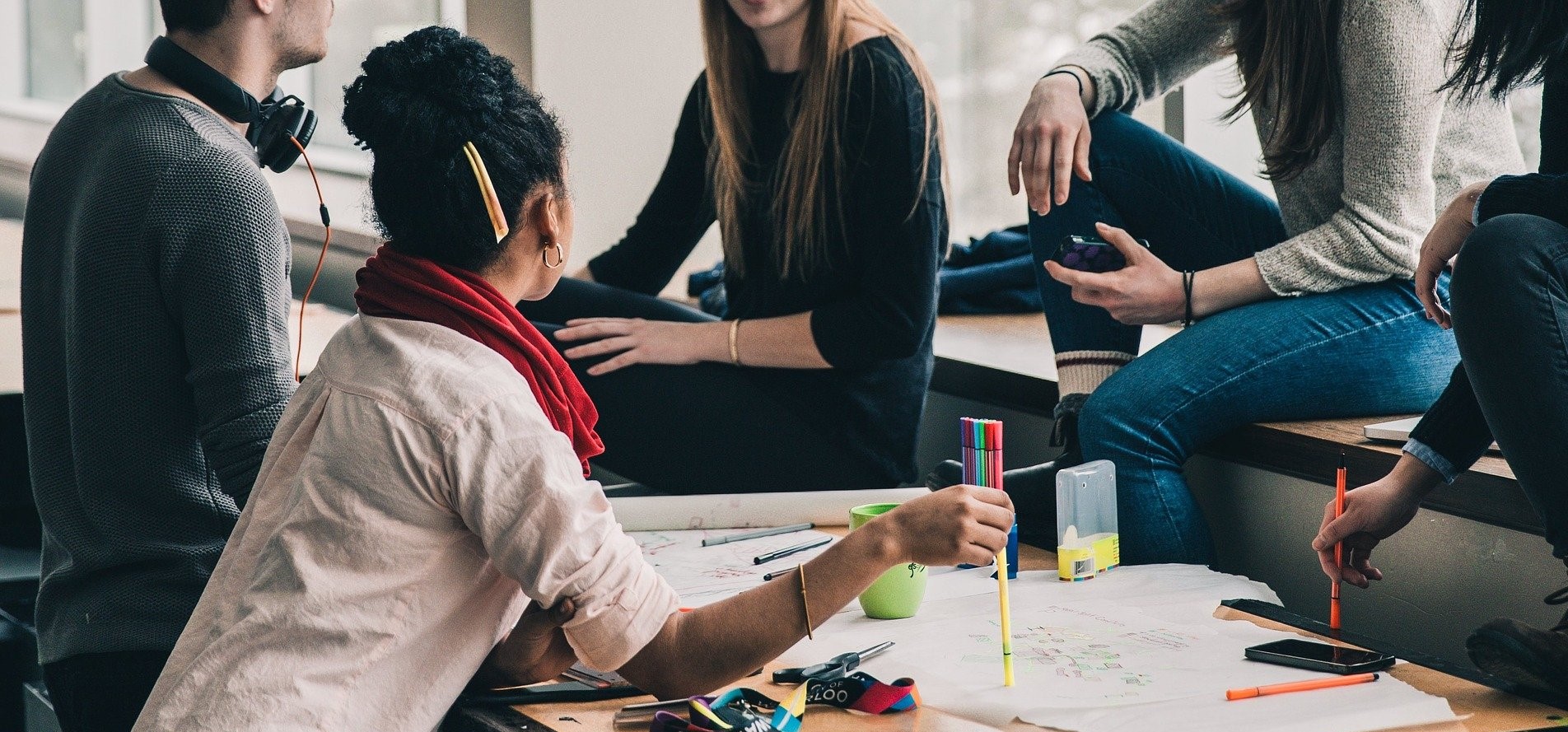 Defining your target audience for web design - people brainstorming in a group.