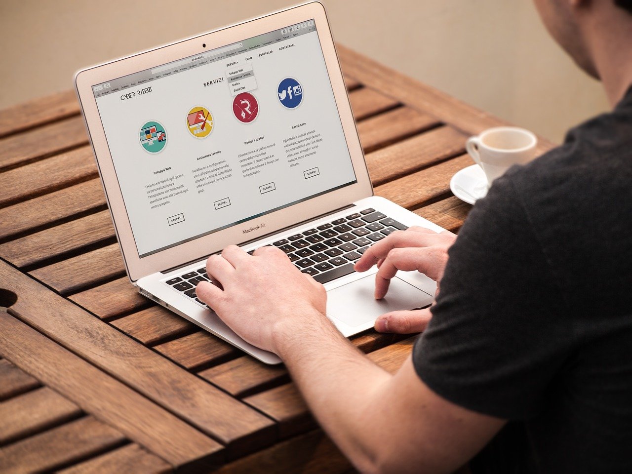 Man using laptop to show quality web design of the WaaS model, offered by expert Devonport web designers, The Tasmanian Web Company.